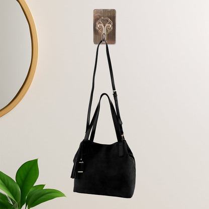 Clear self-adhesive wall hook for compact storage