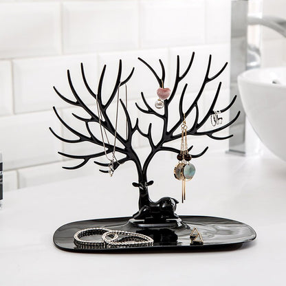 Side view of deer shaped jewellery holder showcasing antler branches and oval tray