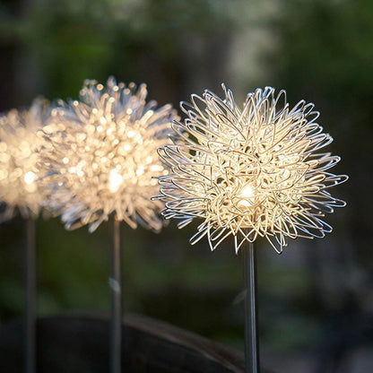 Solar LED dandelion garden lights displaying bright multicolor glow at night