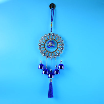 Hanging Om wind chime featuring evil eye protection charm