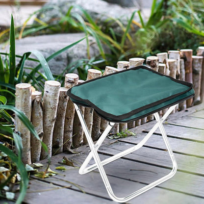 Lightweight Folding Camping Stool positioned beside a tent, showcasing outdoor readiness.