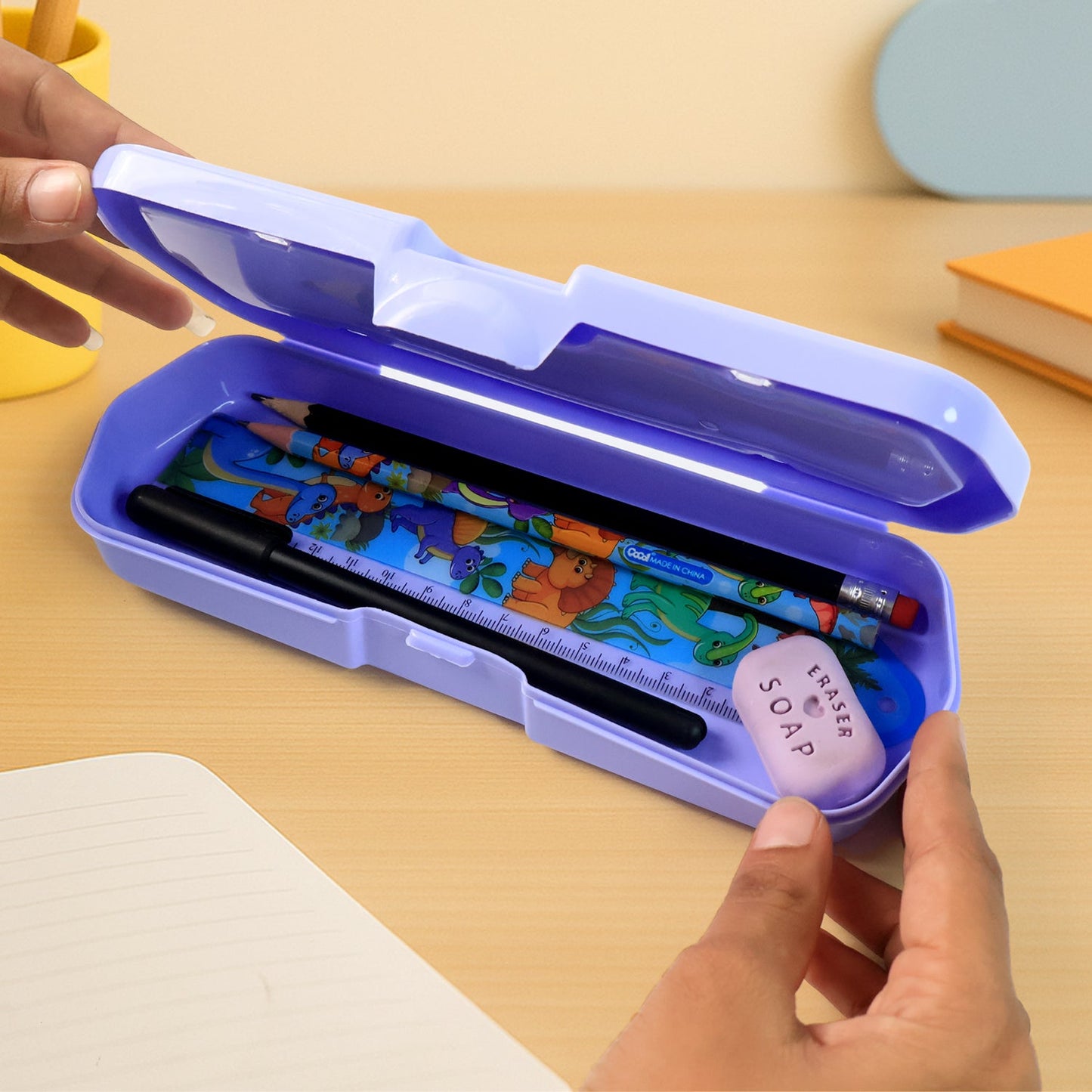 Angled view showing the secure snap-lock closure on the plastic Kids Pencil Box.