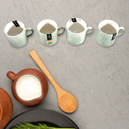 An overhead view of the Serve Stellar 6-piece serving set, emphasizing the coordinated design of the ceramic cups and plastic platter.