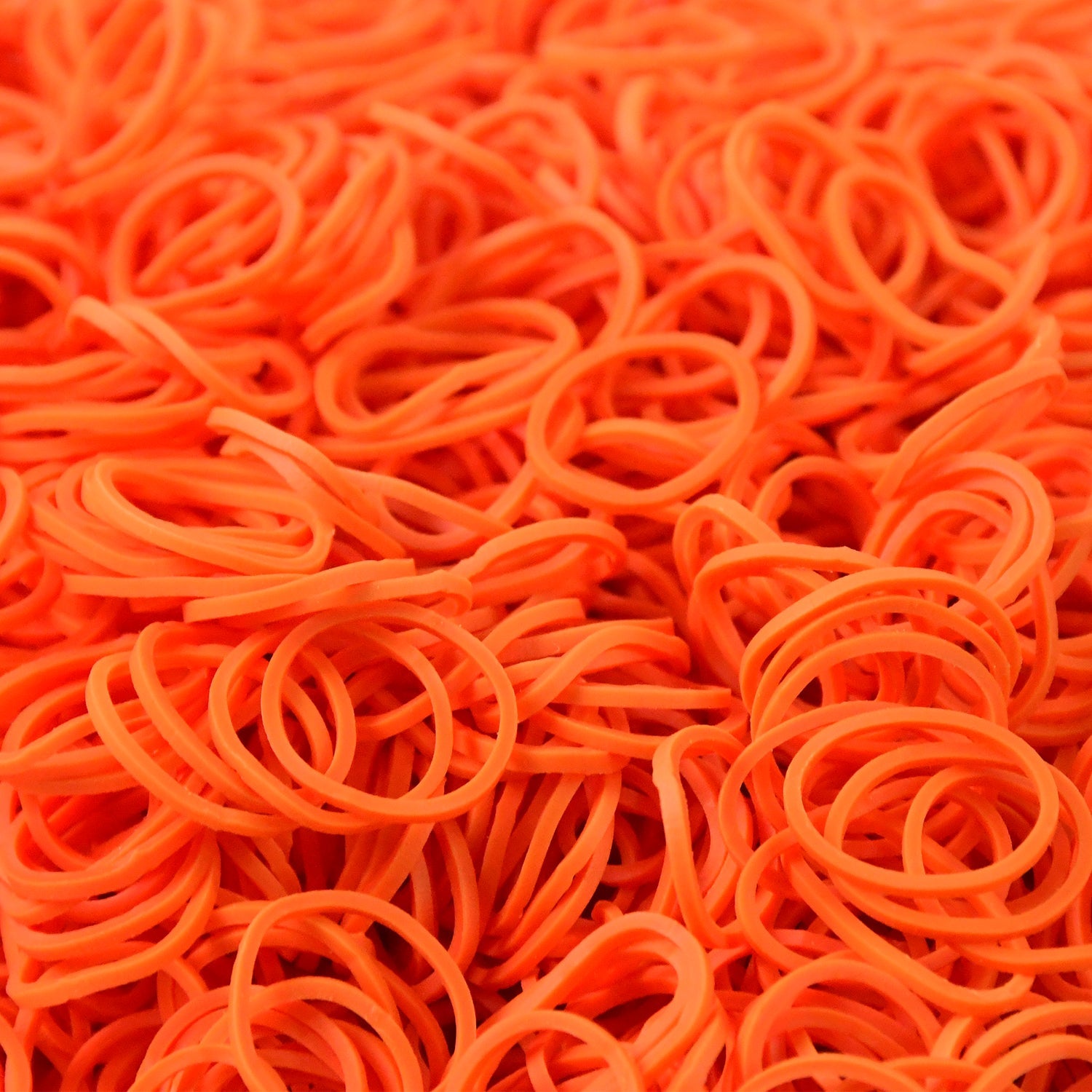 Orange elastic rubber bands closeup showing texture