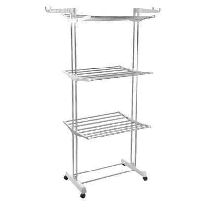 The 3-tier stainless steel drying rack with wheels, fully loaded with laundry.
