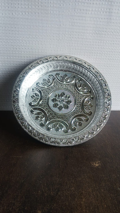Side view of traditional silver finish lightweight plastic pooja thali
