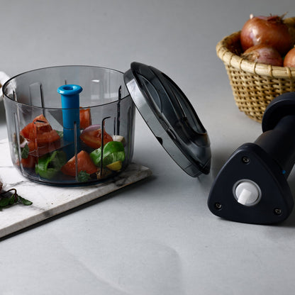 Push chopper featuring secure lock mechanism, ideal kitchen tool