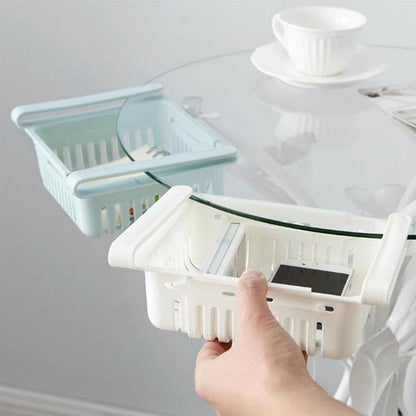 Empty adjustable fridge storage basket showcasing its clear, durable design.