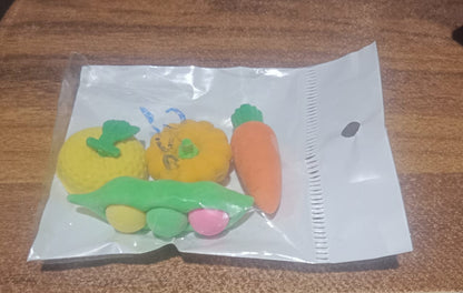 Playful display of vibrant erasers on a clean white surface.