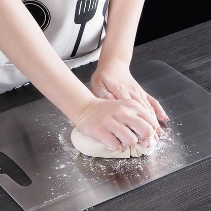 Smooth surface on stainless steel cutting board preventing knife dulling