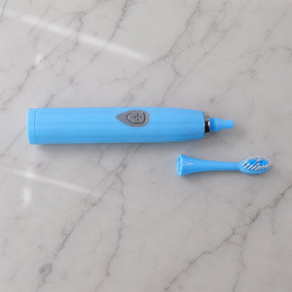 The travel electric toothbrush with its protective cap on, ready for packing and transport.