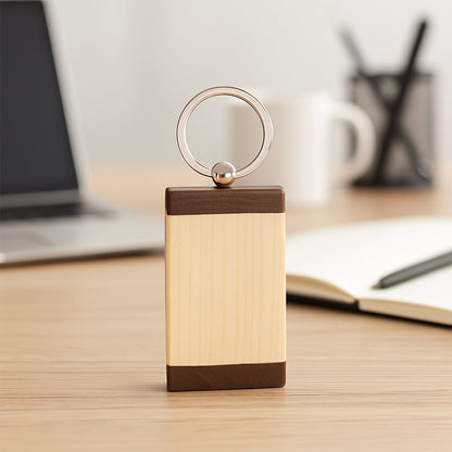 Top view of wooden keychain with dual-tone finish and metal ring