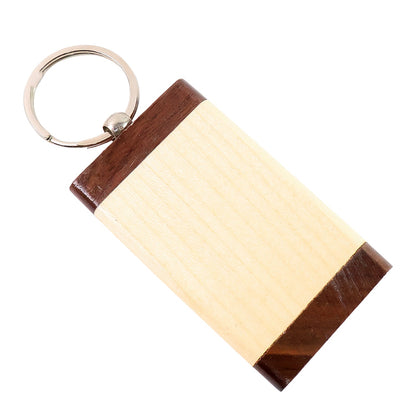 Detailed view of dual-tone finish on wooden keychain highlighting natural wood grain