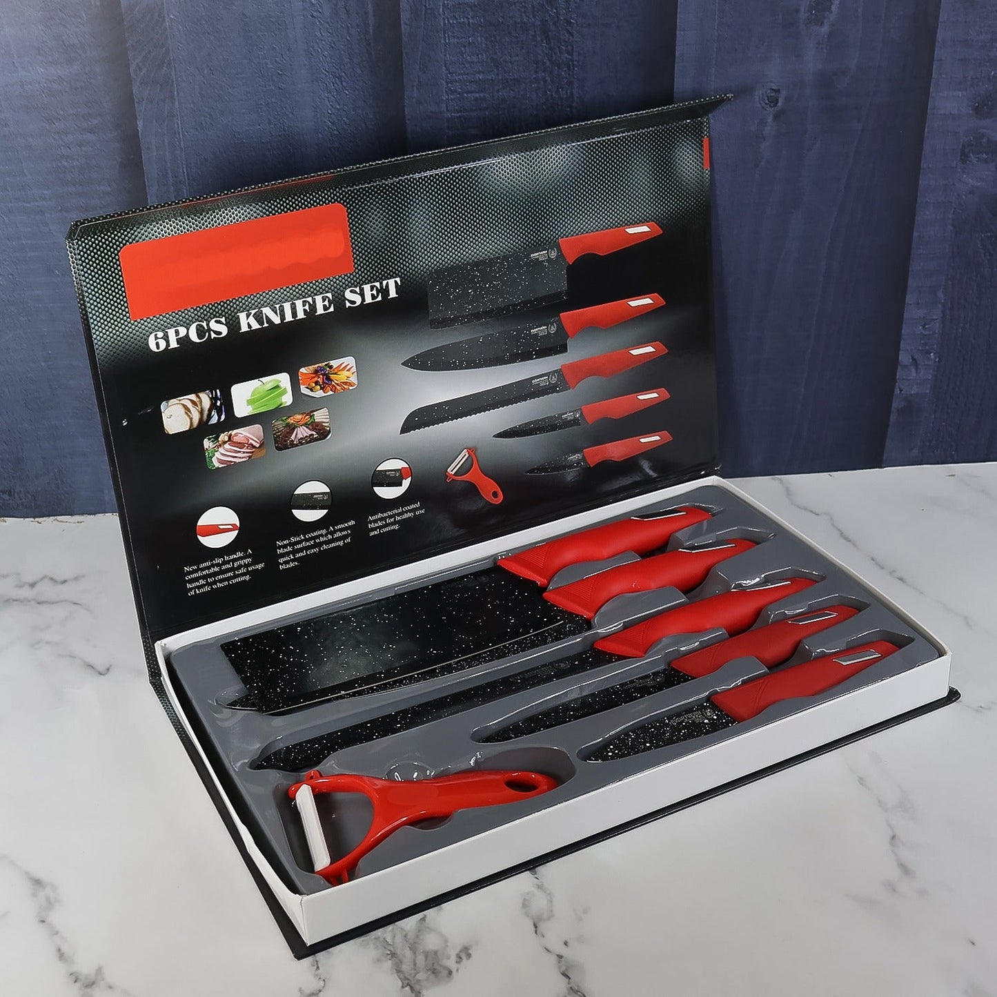 Kitchen knife set with anti-slip red handles and marble patterned blades