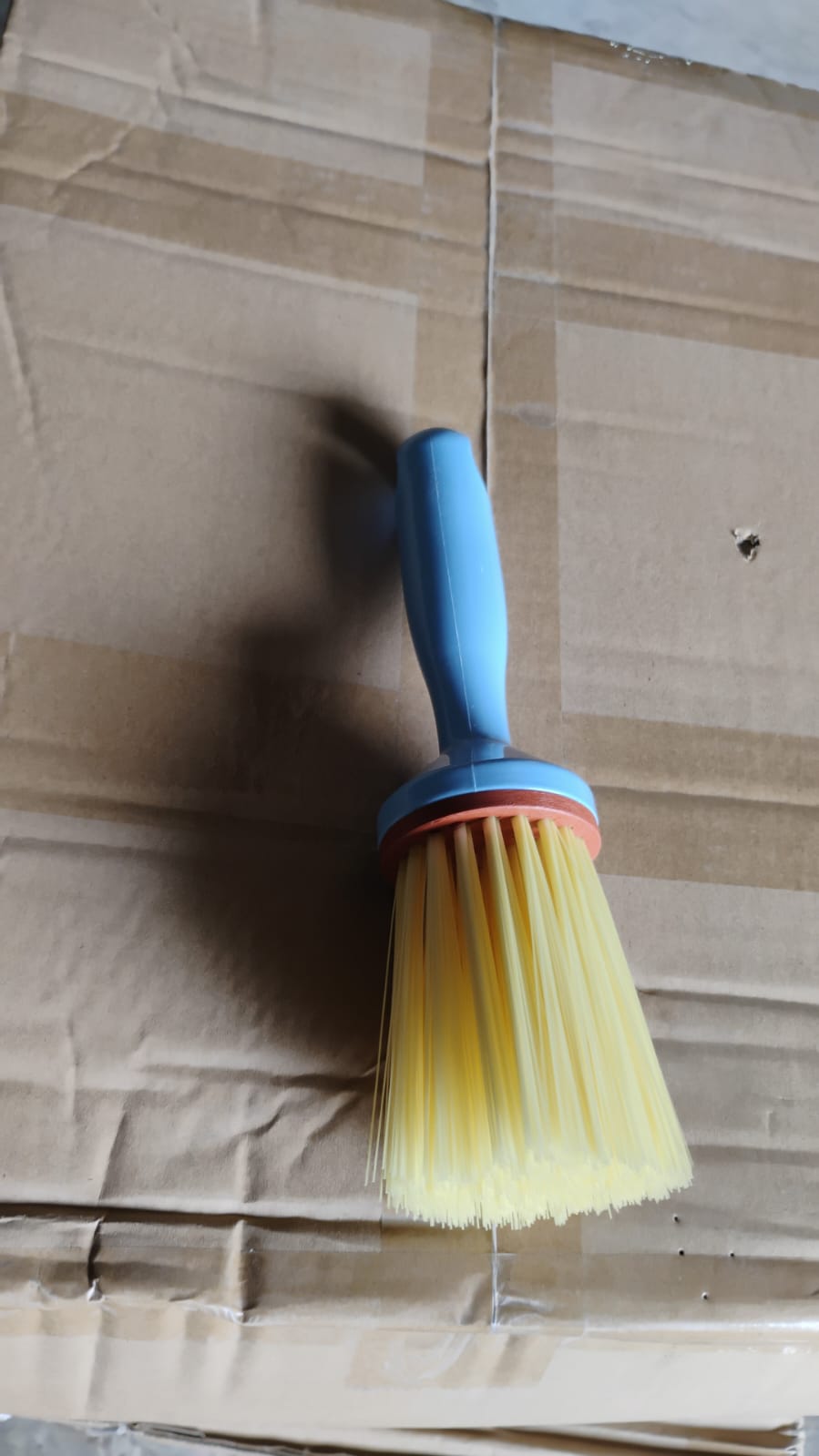 Multi-purpose plastic cleaning brush designed for kitchen and bathroom scrubbing